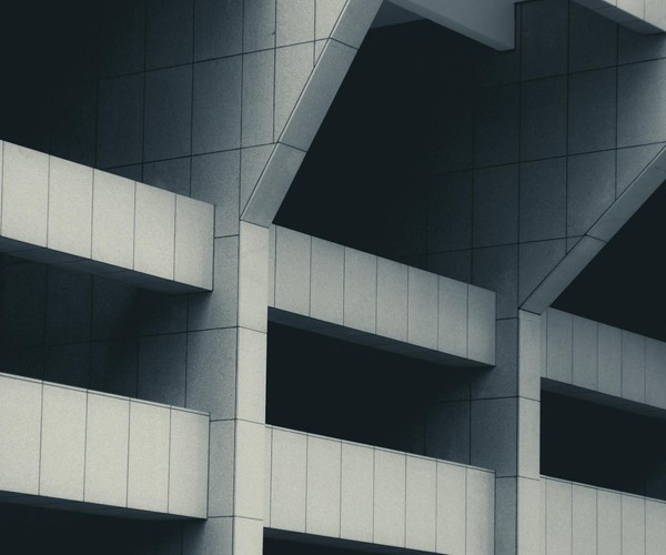 Abstract modern building facade showcasing geometric architectural design and patterns.